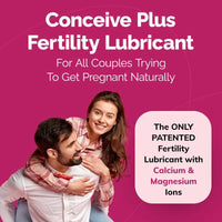 Advertisement for Conceive Plus Fertility Lubricant featuring a couple on a pink background.