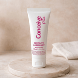 Tube of Conceive Plus fertility lubricant on a beige background