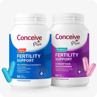 Conceive Plus His + Hers Fertility Support bottle bundle showing Men's Fertility Support in blue and Women's Fertility Support in purple, each with 60 vegan capsules, displayed with matching blue and pink capsules on a white background.