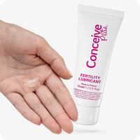 Max Fertility Lubricant Bundle featuring image of 75ml tube and gel shown on hand for texture and scale, ideal for couples trying to conceive. White tube has pink branding.