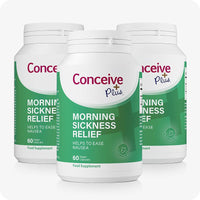 Conceive Plus Morning Sickness Relief 3-pack bundle, each bottle containing 60 vegan capsules. Green and white labels emphasize nausea support during pregnancy using ginger powder. Clean layout with bold magenta branding and high color contrast for visibility.