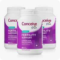 Conceive Plus Ovulation Bundle showing three bottles of Women's Fertility Support with bold purple labeling, each containing 60 vegan capsules, arranged in a staggered formation on a white background.