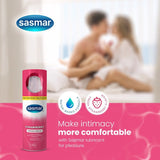 Sasmar strawberry personal lubricant bottle with couple in background on pink background