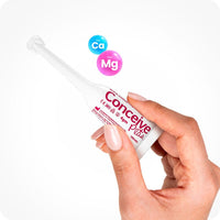 TRY ME SIZE Fertility Lubricant Bundle featuring image of single-use 4g applicator shown in hand with calcium and magnesium ions graphic. White applicator with pink text.