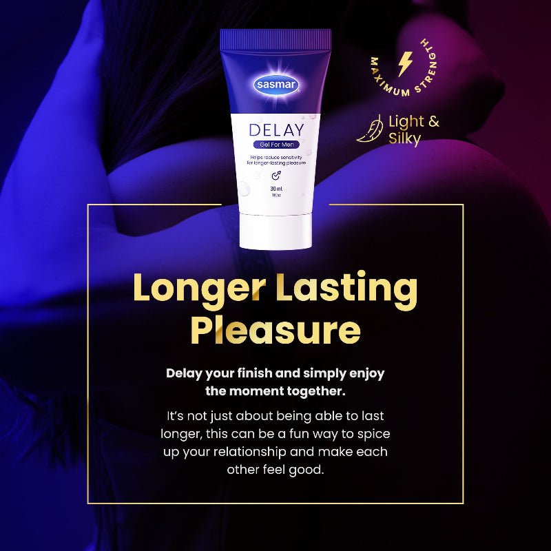 A tube of Sasmar Delay lubricant is centered against a dark, stylized background with blue and purple lighting and a blurred human body. Large text reads 'Longer Lasting Pleasure' with smaller descriptive copy below, and circular badges mention 'Light & Silky' and 'Maximum Strength'.
